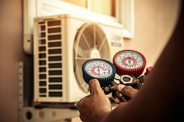 Professional Air Conditioning Service technician working in Lenexa, KS